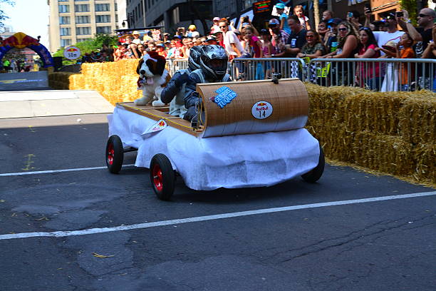 Montreal Red Bull Soapboax Race Montreal, Canada - September 06, 2015: Montreal Red Bull Soapboax Race in Montreal Downtow.A lot of fun and ingenious ideas.Number 14-Guerre tuques team. red bull mini stock pictures, royalty-free photos & images