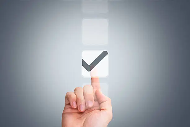 Photo of Male Hand Touching Button and Ticking Check Box