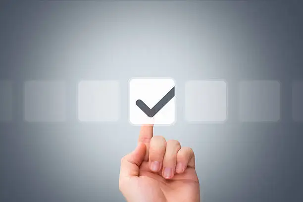 Photo of Male Hand Touching Button and Ticking Check Box