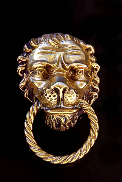 istock Lion's Head Door Knocker on Black background 487463756