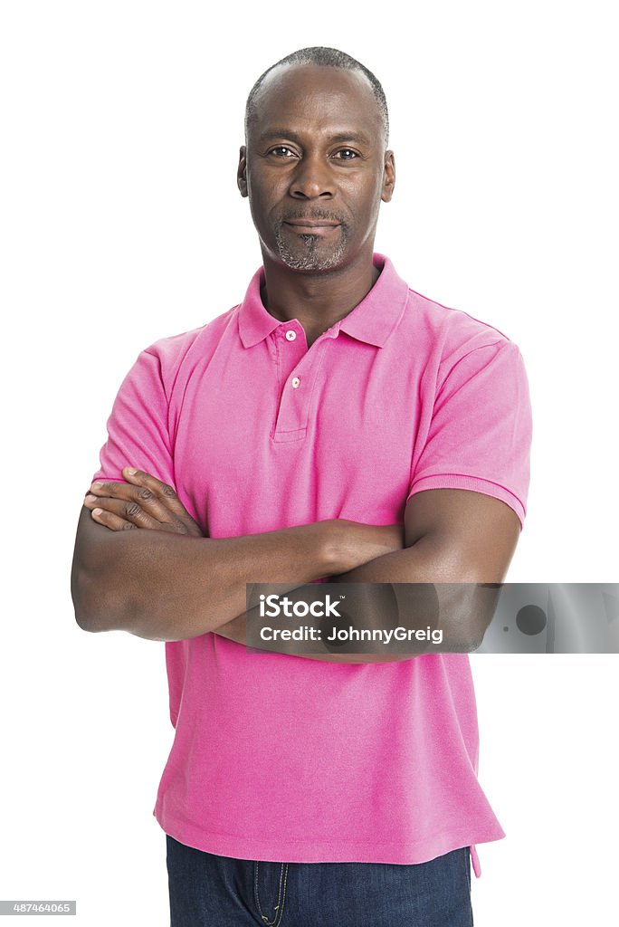 Confident African Man Portrait of serious mature African man standing arms crossed. White background Men Stock Photo
