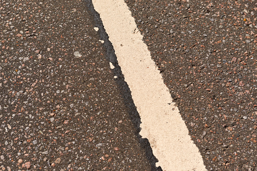 White lines on road. Asphalt texture background