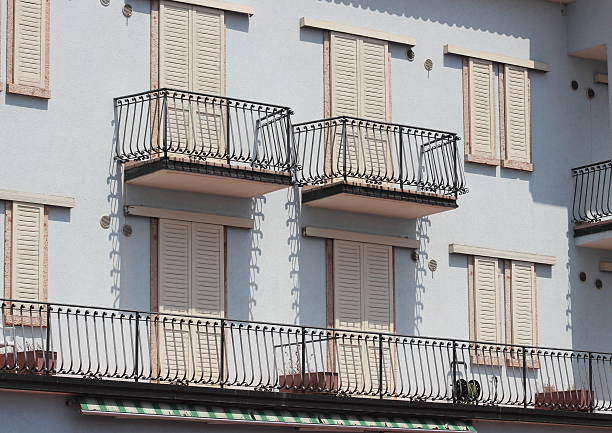 istock Facade af building with balcony and iron fence 487464979