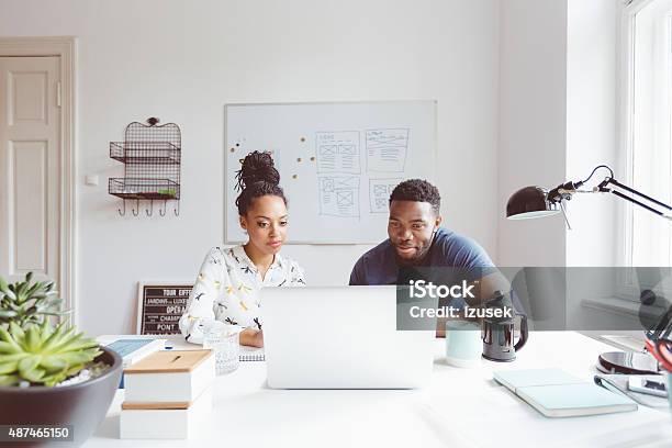 Startup Agency Afro American Woman And Man Collaborating Stock Photo - Download Image Now
