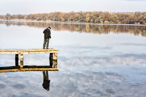 Graybeard looking a lake