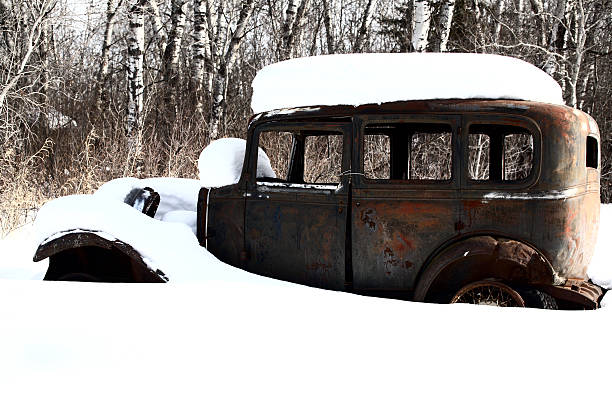 istock Snow covered antique automobiles 487468775