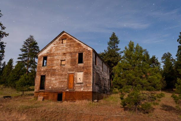 Old homestead log cabin in the forest landscape of Grand Teton National Park, Wyoming during autumn.