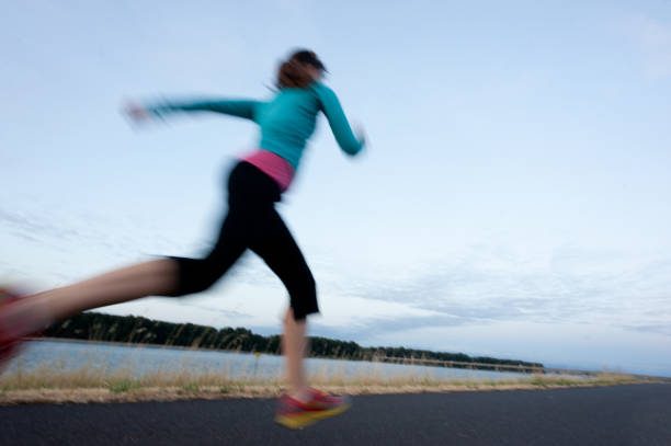 istock Woman runs on path next to the Columbia River 487469382