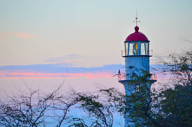 Lighthouse at sunset stock photo