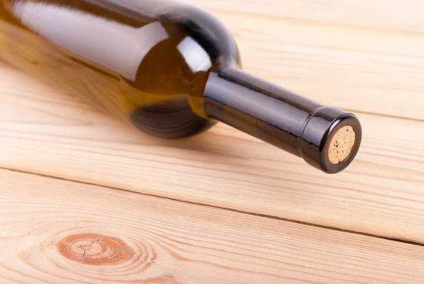 istock Bottle of wine on a wooden table. 487470657