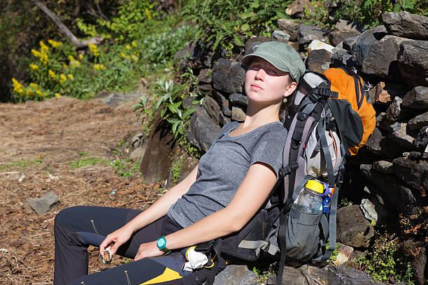istock Woman backpacker tourist rest lying back. 487470672