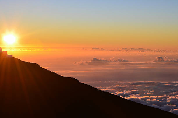 Sunset above the clouds at Haleakala stock photo