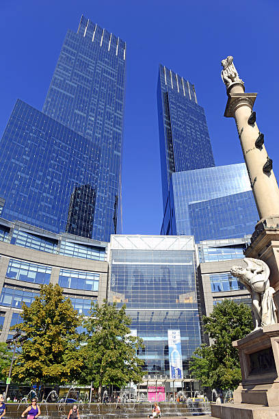 Time Warner Center in Manhattan with blue sky New York, USA. September 7, 2015: Located near many of Manhattan’s attractions, the iconic Time Warner Center is a tourist hotspot with a variety of shopping and restaurants to suit many tastes. time warner center columbus circle pictures stock pictures, royalty-free photos & images