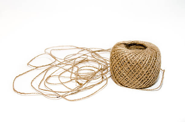 istock Skein of hard brown twine on a white background 487475254