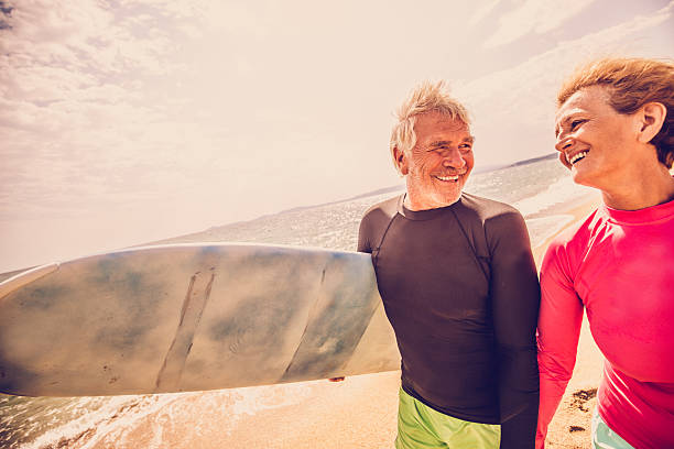istock Senior couple of surfers 487475854