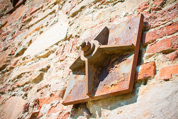 istock Old brick wall reinforced with metal plates 487476614