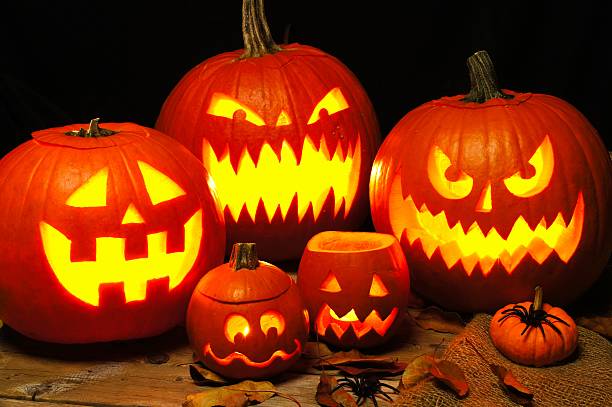 istock Halloween night scene with illuminated Jack o Lanterns 487479402