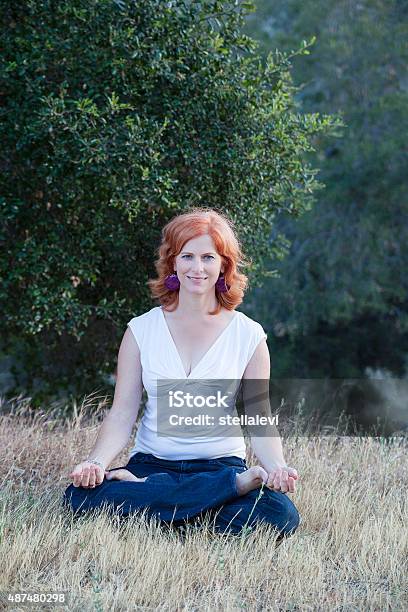 Beautiful Woman Meditating In Nature Stock Photo - Download Image Now - 2015, Adult, Adults Only