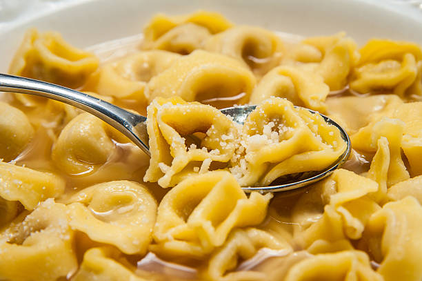 Bologna Tortellini and Parmesan cheese stock photo
