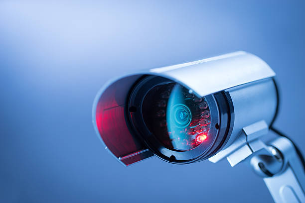 Security CCTV camera in office building Security, CCTV camera for office building at night in London. surveillance camera stock pictures, royalty-free photos & images