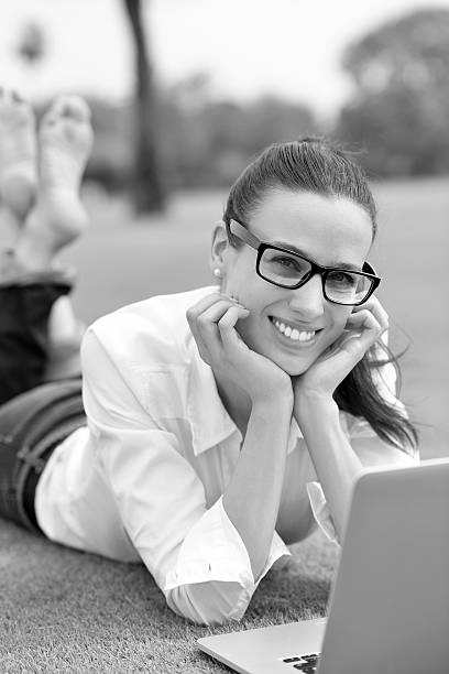 istock woman with laptop in park 487484909