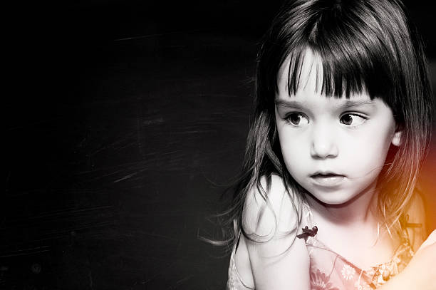 Beautiful caucasian little girl posing looking at the camera