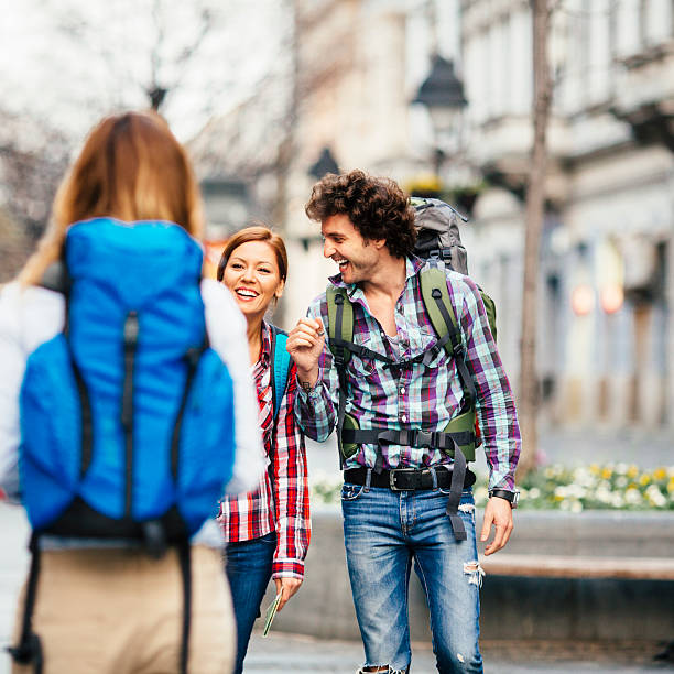 istock Happy Backpackers meeting in the city. 487485233