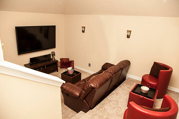 istock Media room in upscale, new home. Large TV, sofa, seating. 487486123