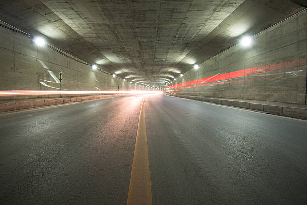 istock car moving in Tunnel 487486945