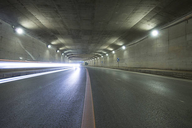 istock car moving in Tunnel 487486951
