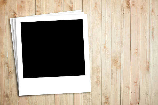 istock Polaroid photo frame on wood plank background 487487067