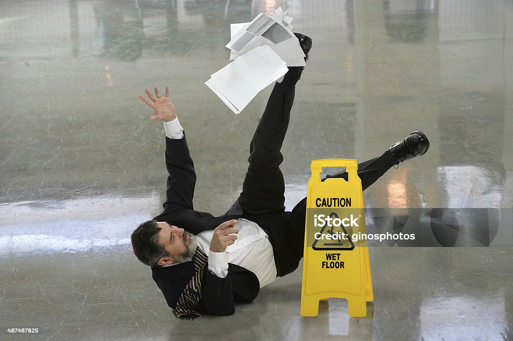 Businessman Falling on Wet Floor - Royalty-free Düşmek Stok görsel