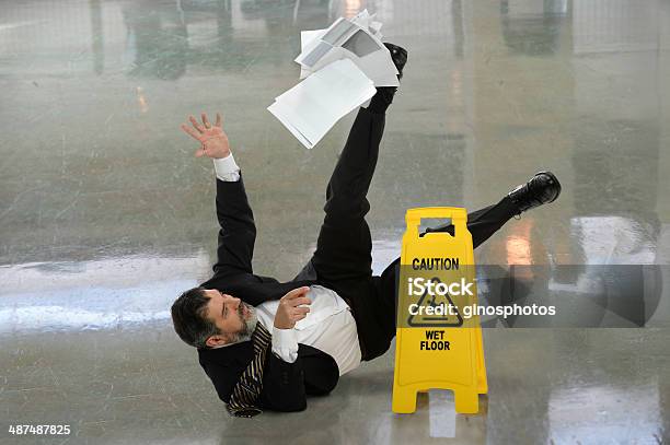 Businessman Falling On Wet Floor Stok Fotoğraflar & Düşmek‘nin Daha Fazla Resimleri - Düşmek, Kaygan, Yer kaplama