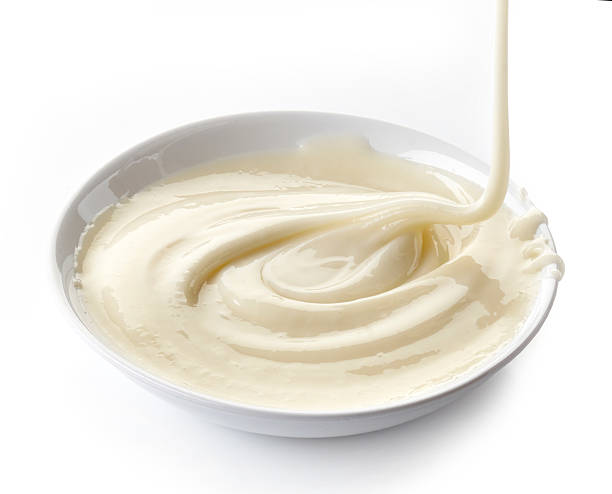 istock condensed milk with sugar in a bowl 487488789