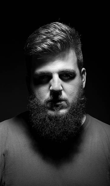 istock Bored mysterious male portrait. Low key, black background. 487489100