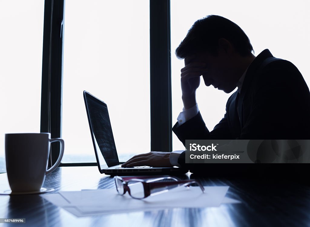 Stressed businessman Stressed businessman in the office. Businessman Stock Photo