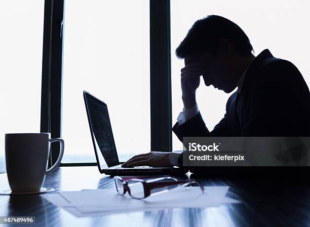 Stressed Businessman Stock Photo - Download Image Now - Businessman, Distraught, In Silhouette