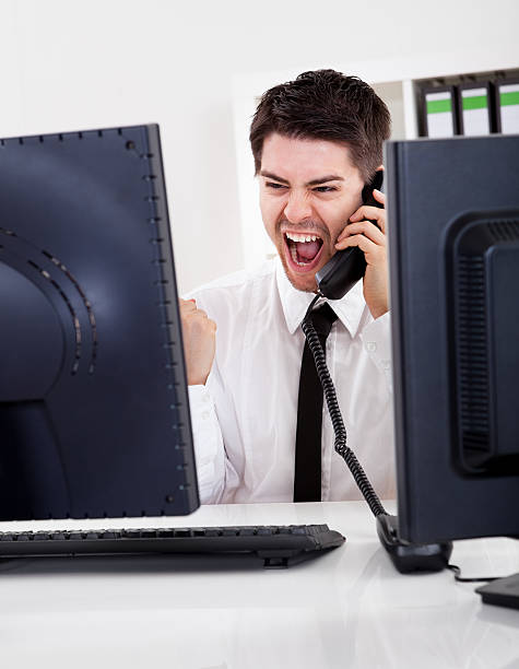 istock Smiling stock broker with telephone 487490385
