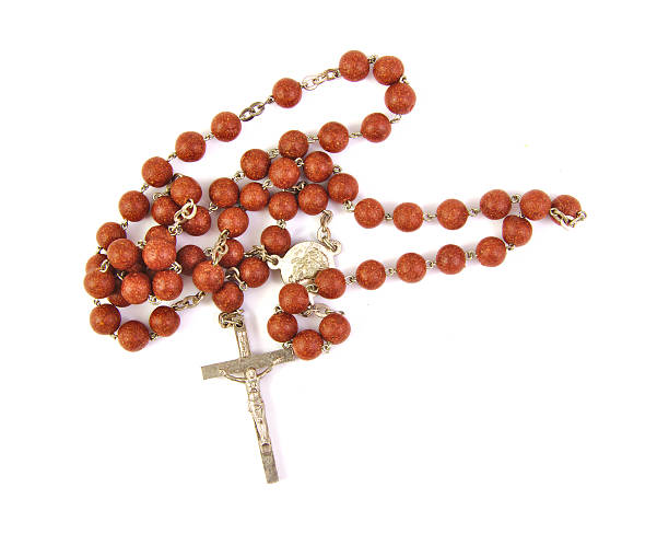 istock wooden rosary with a cross on white background 487490982