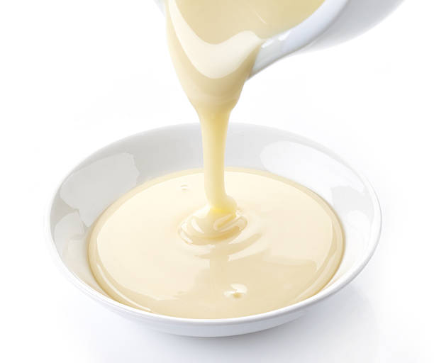 istock pouring condensed milk with sugar in a bowl 487491269