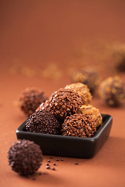 istock various chocolate candies in a black bowl 487491455