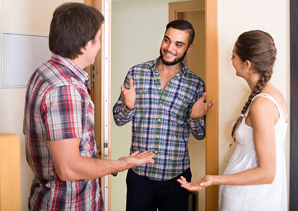 istock Family couple inviting friend 487491872