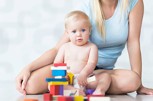 istock Mother and baby playing with blocks 487495032