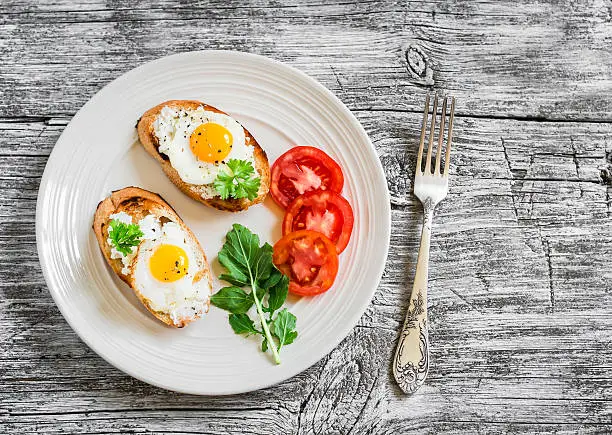 Photo of toast with soft cheese and quail eggs