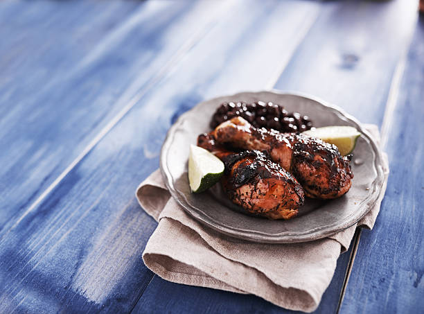 istock grilled jamaican jerk chicken on plate 487501040