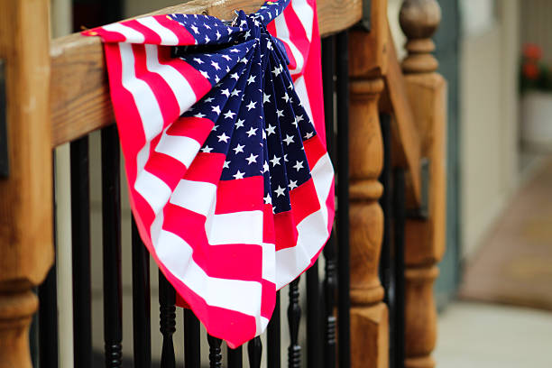istock Flag Decoration Hanging From Wood Railing 487501148