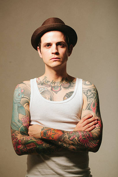 Portrait Of A Tattooed Man Stock Photo - Download Image Now - Hat, Men,  Tattoo - iStock