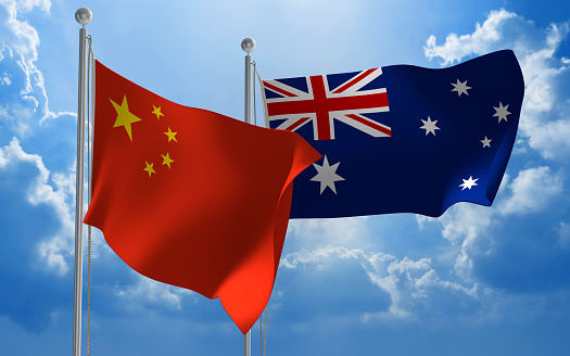 Flags from China and Australia flying side by side for important talks.