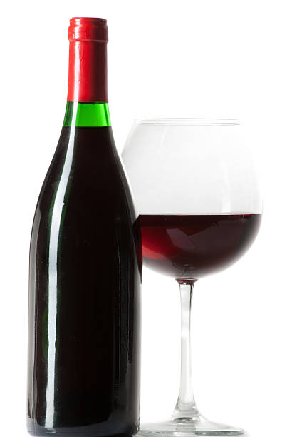 istock Wine bottle and filled glass isolated on white 487507151