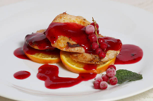 istock Grilled chicken fillet with berry sauce 487508122